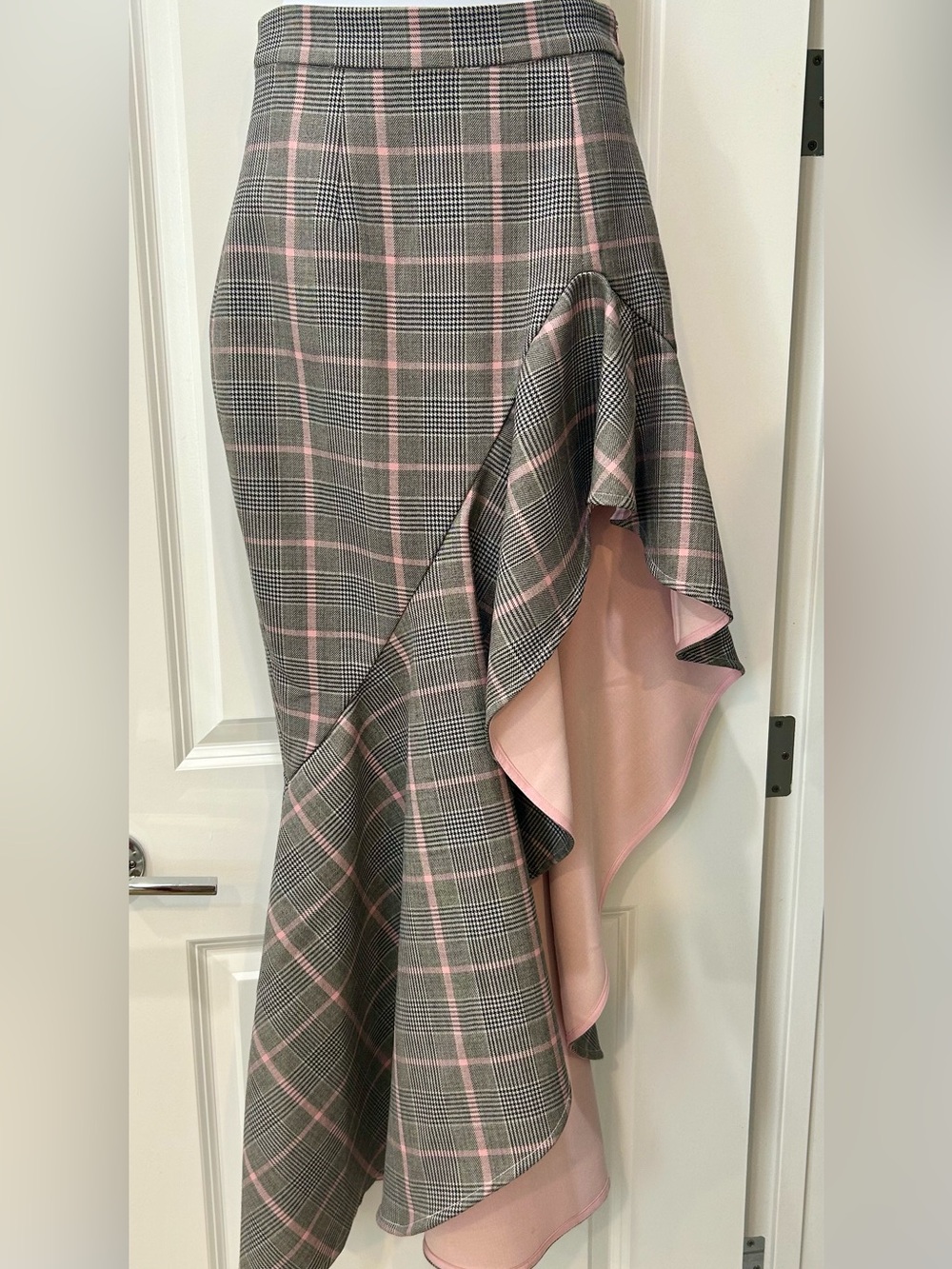 Aslio. Asymmetrical wool lined skirt. Pink and black/ white plaid